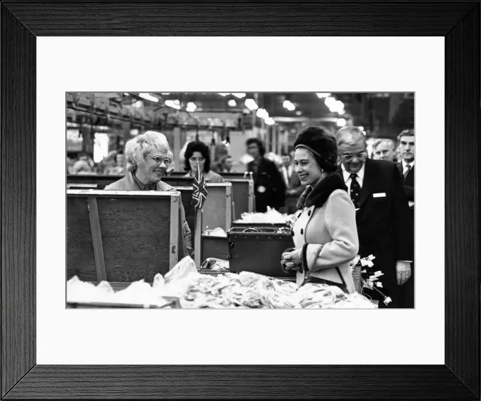 Framed Print : Queen Elizabeth II pauses to talk to one of the women on the assembly line during her Framed Print : Queen Elizabeth II pauses to talk to one of the women on the assembly line during her