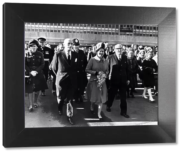 Queen Elizabeth II walks to Cardigan House from the hospital with Dr J. P
