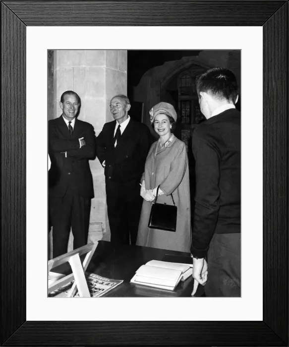 Framed Print : The Duke of Edinburgh, Rear Admiral D. J Hoare and The Queen share a joke with a student Framed Print : The Duke of Edinburgh, Rear Admiral D. J Hoare and The Queen share a joke with a student