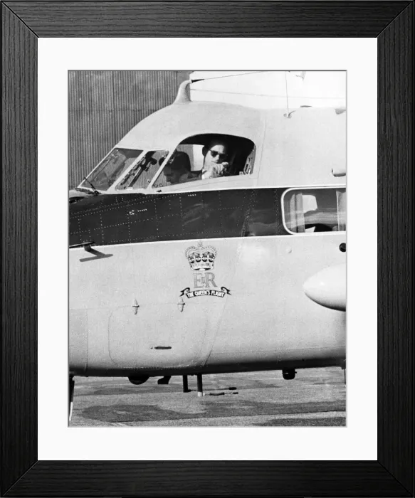 Framed Print : Prince Philip, the Duke of Edinburgh turns towards the crowd for a last look as he taxies Framed Print : Prince Philip, the Duke of Edinburgh turns towards the crowd for a last look as he taxies