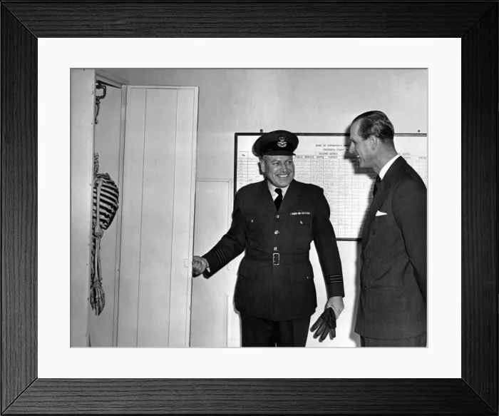 Framed Print : Prince Philip, the Duke of Edinburgh enjoys the joke played upon him in one of the huts Framed Print : Prince Philip, the Duke of Edinburgh enjoys the joke played upon him in one of the huts