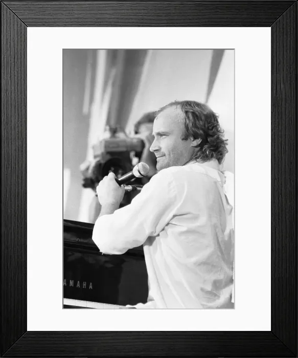 Framed Print : Phil Collins performing on stage at the John F. Kennedy Stadium, Philadelphia Framed Print : Phil Collins performing on stage at the John F. Kennedy Stadium, Philadelphia