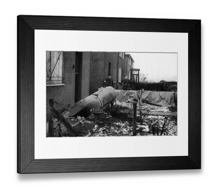 Framed Print : A unexploded parachute mine outside 10 Ellerby Grove, East Hull being visually inspected