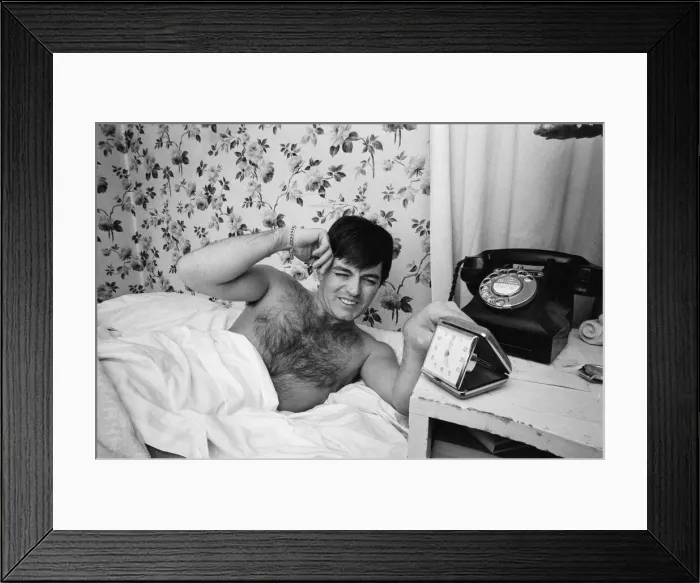Framed Print : Tony Blackburn, the 22 year old Disc Jockey, in bed at his Knightsbridge flat Framed Print : Tony Blackburn, the 22 year old Disc Jockey, in bed at his Knightsbridge flat