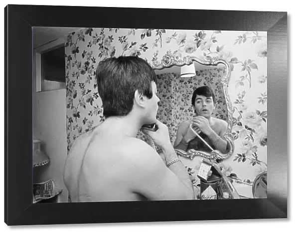 Tony Blackburn, the 22 year old Disc Jockey, washes and shaves early in the morning