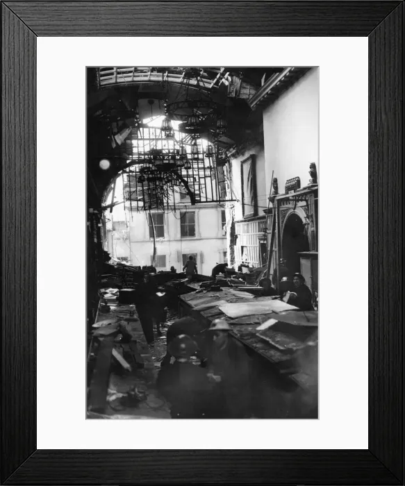Framed Print : Salvage workers shift through the wreckage the Guildhall after a direct hit