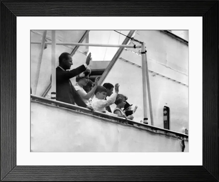 Framed Print : The Royal family visit wales. The Royal party waves to the crowds as they sail Framed Print : The Royal family visit wales. The Royal party waves to the crowds as they sail