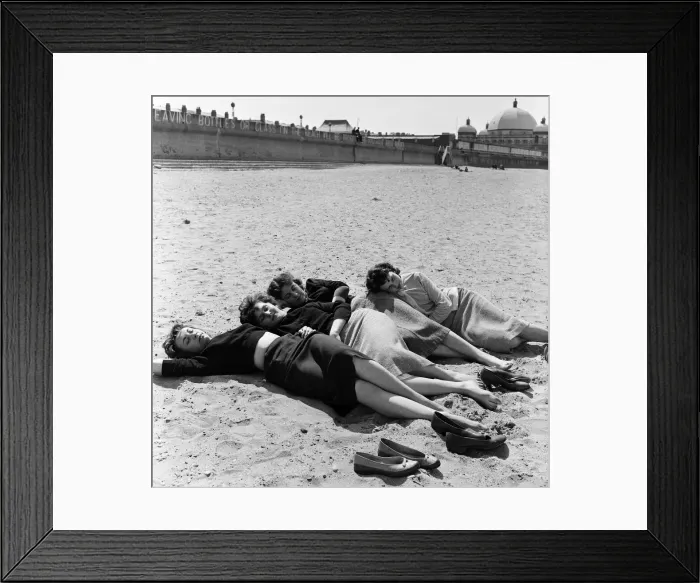 Framed Print : These young ladies, office workers, took a lunch hour paddle at Rhyl which has its Framed Print : These young ladies, office workers, took a lunch hour paddle at Rhyl which has its