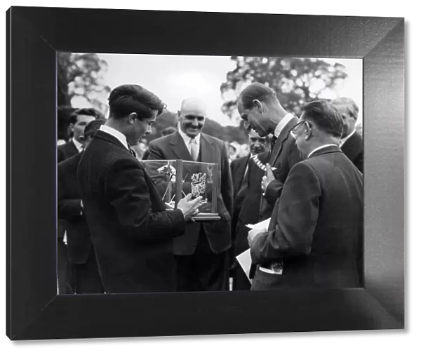Prince Philip visiting Wales. David De Lloyd presents HRH with a modernistic ashtray