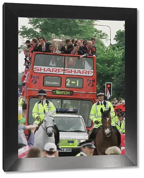 Manchester United team on open top bus May 1999 during their homecoming tour of