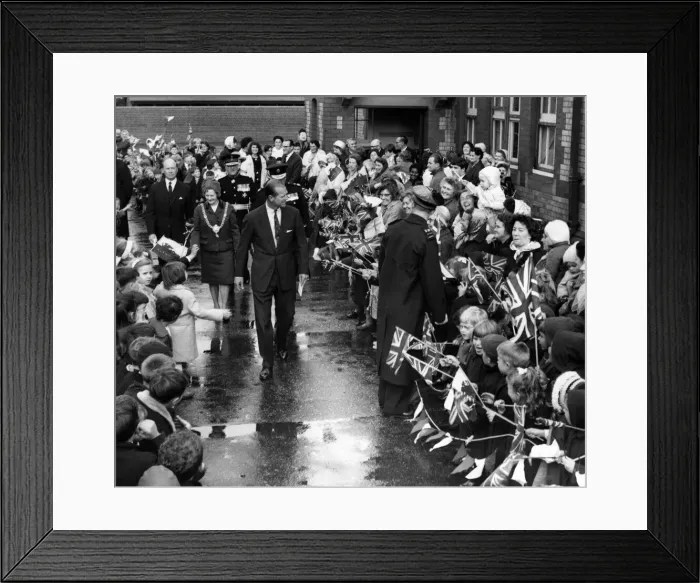 Framed Print : The Duke of Edinburgh walks through the lines of flag waving pupils at Kitchener Road Framed Print : The Duke of Edinburgh walks through the lines of flag waving pupils at Kitchener Road