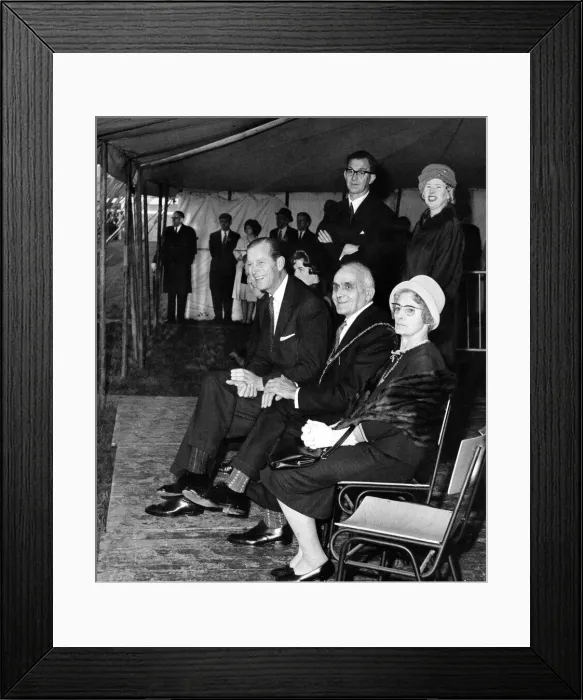 Framed Print : Prince Philip visiting Wales. The Duke of Edinburgh laughing heartily as he watches a Framed Print : Prince Philip visiting Wales. The Duke of Edinburgh laughing heartily as he watches a