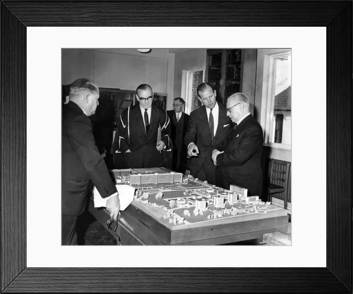 Framed Print : Prince Philip visiting Wales. The Duke of Edinburgh discusses a model of the new Teaching Framed Print : Prince Philip visiting Wales. The Duke of Edinburgh discusses a model of the new Teaching