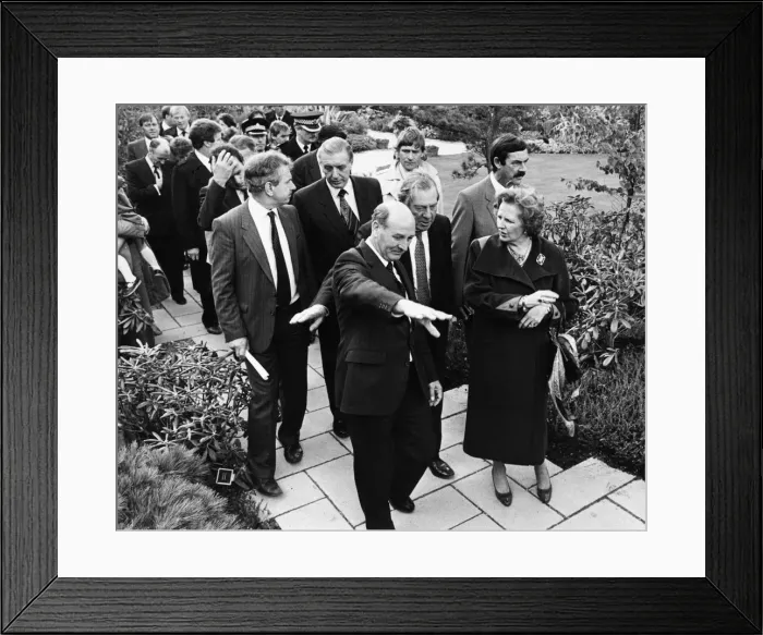 Framed Print : British Prime Minister Margaret Thatcher is led by Sir Leslie Young through the British