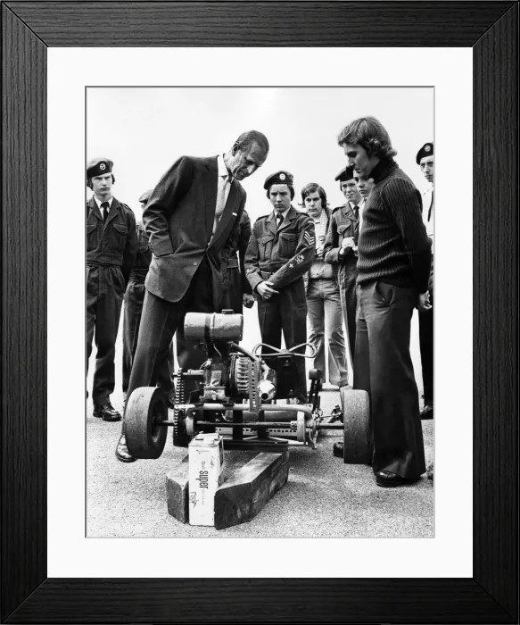 Framed Print : Prince Philip visiting Wales. The Duke of Edinburgh looks at a Go-cart made by members of Framed Print : Prince Philip visiting Wales. The Duke of Edinburgh looks at a Go-cart made by members of