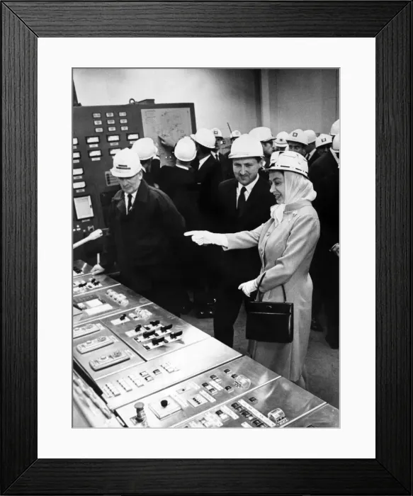 Framed Print : Queen Elizabeth II wearing protective clothing, watches the control panel of the new Framed Print : Queen Elizabeth II wearing protective clothing, watches the control panel of the new