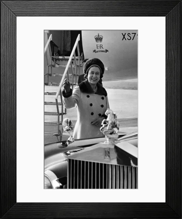 Framed Print : Queen Elizabeth II waves to onlookers, as she walks to her car from the aircraft Framed Print : Queen Elizabeth II waves to onlookers, as she walks to her car from the aircraft