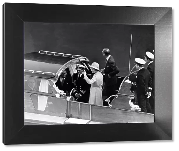 Queen Elizabeth II and Prince Philip pictured leaving Barry docks on the Royal barge