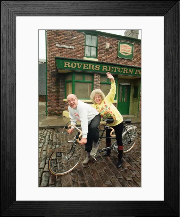 Framed Print : Julie Goodyear and Roy Barraclough pictured on a tandem bike on the set of Coronation Framed Print : Julie Goodyear and Roy Barraclough pictured on a tandem bike on the set of Coronation