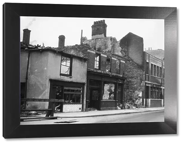 Wrecked and burnt out shops on Lombard Street, Hull following a raid on the centre of