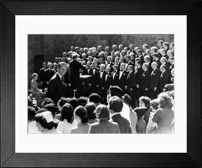 Framed Print : Prince Philip visiting Wales. The Duke of Edinburgh smiling at local children as Framed Print : Prince Philip visiting Wales. The Duke of Edinburgh smiling at local children as