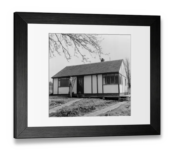 Framed Print : Prefab Bungalow. Prefab Housing. Mr Baker examines his new £ Framed Print : Prefab Bungalow. Prefab Housing. Mr Baker examines his new £