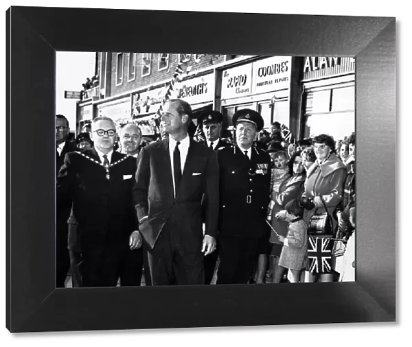 As Prince Philip walks through Billingham Square Shopping Centre he looks at the new two