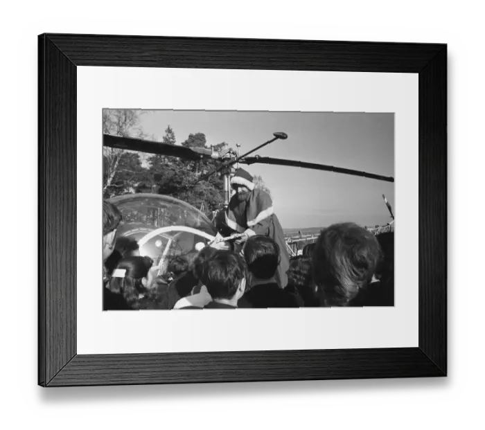 Framed Print : Santa Claus arrives by helicopter at Pestalozzi Village for Children in Sedlescombe
