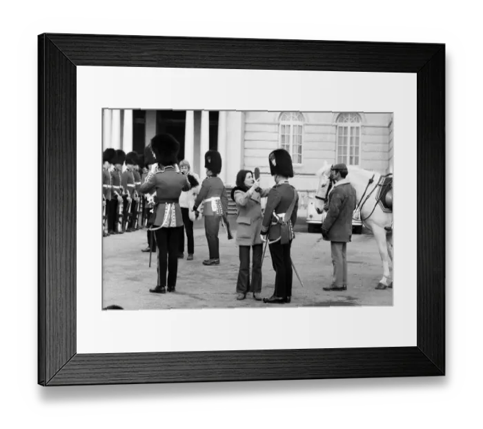 Framed Print : A quick brush for one of the officers during the filming of Framed Print : A quick brush for one of the officers during the filming of