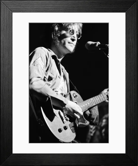 Framed Print : Former singer of The Beatles pop group John Lennon pictured performing on stage during Framed Print : Former singer of The Beatles pop group John Lennon pictured performing on stage during