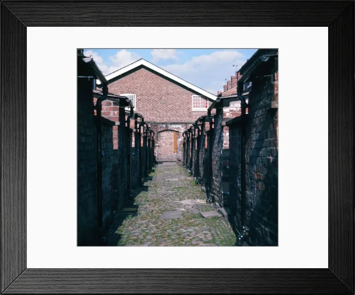 Framed Print : Back alley at cottages at the restored Quarry Bank Mill in Styal, Cheshire, 1973 Framed Print : Back alley at cottages at the restored Quarry Bank Mill in Styal, Cheshire, 1973