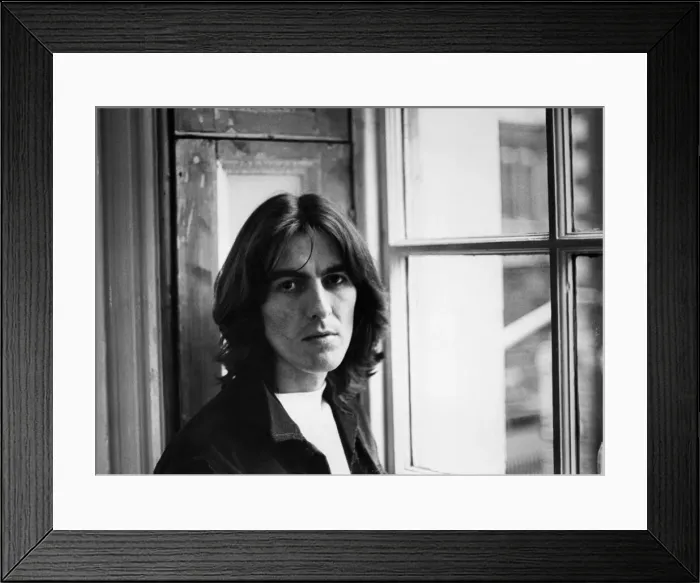 Framed Print : George Harrison of The Beatles pop group pictured at the Apple Headquarters in London Framed Print : George Harrison of The Beatles pop group pictured at the Apple Headquarters in London
