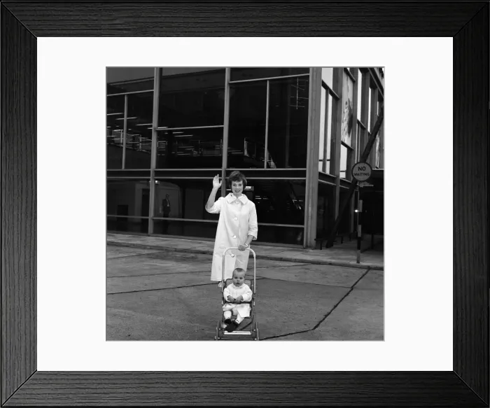 Framed Print : Julie Andrews at London Airport with her daughter Emma. They are flying to California