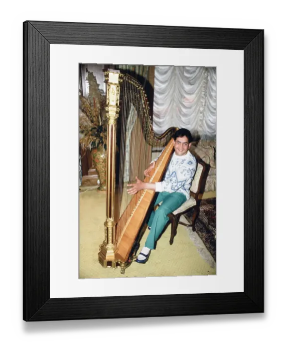Framed Print : World snooker champion Joe Johnson poses in London, playing a harp. 28th May 1986