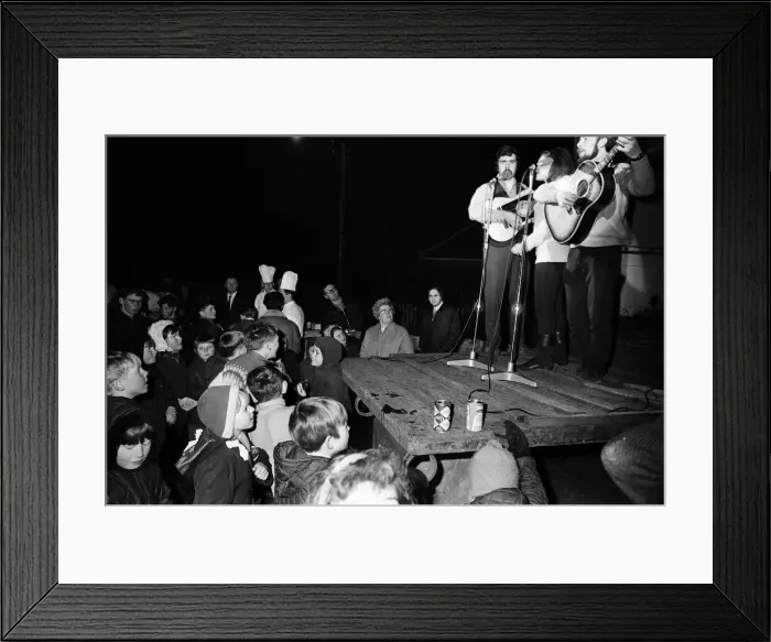 Framed Print : People watching live music during Aviemore Festival Week
