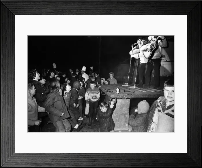 Framed Print : People watching live music during Aviemore Festival Week