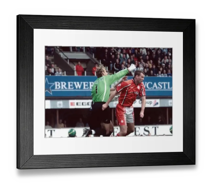 Framed Print : Middlesbrough keeper Mark Schwarzer knocks out team mate Gary Pallister while clearing a