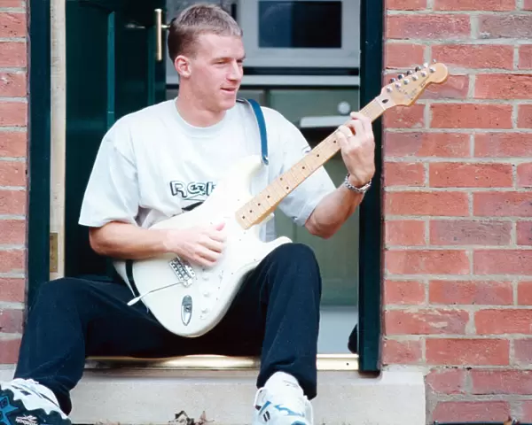Middlesbrough player Robbie Mustoe seen here playing his electric guitar