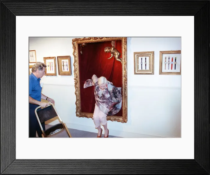 Framed Print : British fashion designer Vivienne Westwood, posing as an oil painting and jumping out Framed Print : British fashion designer Vivienne Westwood, posing as an oil painting and jumping out