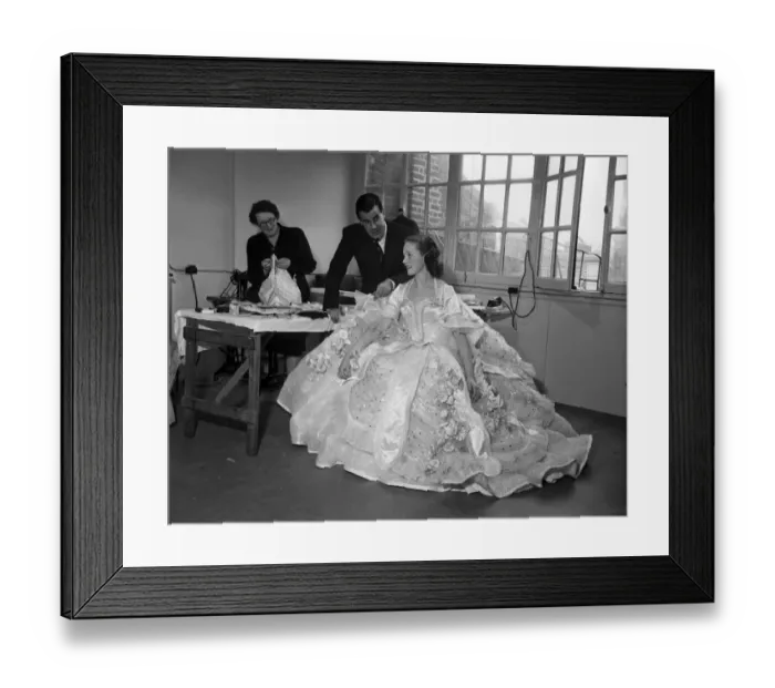 Framed Print : Actress Julie Andrews trying on a dress for her role in the pantomime Cinderella Framed Print : Actress Julie Andrews trying on a dress for her role in the pantomime Cinderella