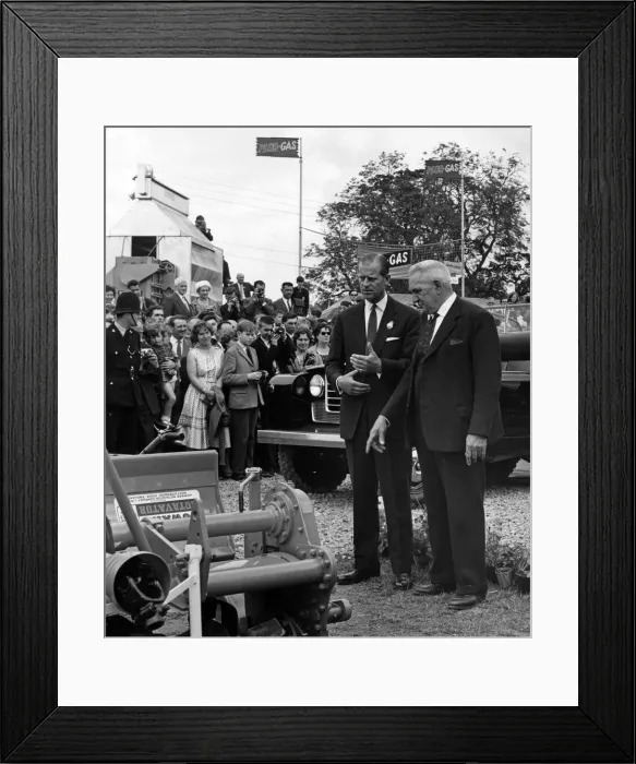 Framed Print : The Duke of Edinburgh showing a vivid interest in farming machinery at the Royal Show