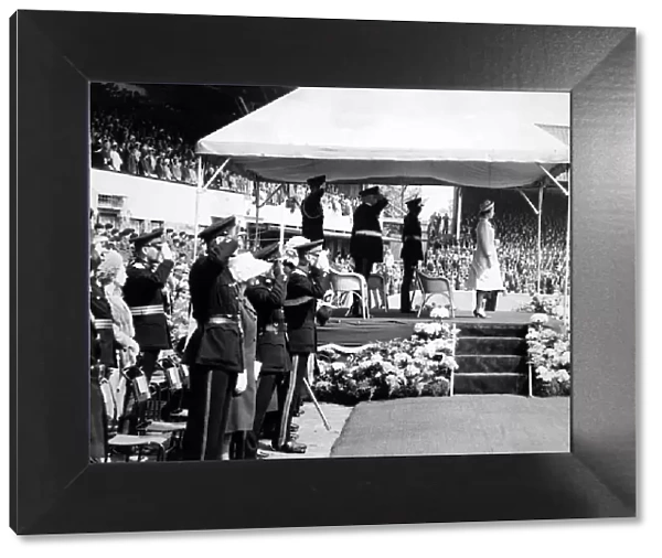 The Queen at Molineux football ground. A crowd of 30, 000 saw her take the salute