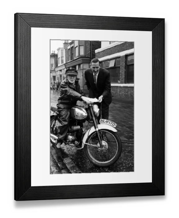 Framed Print : Florrie Ball, 77, is given a cover note for her insurance for her motorbike insurance by