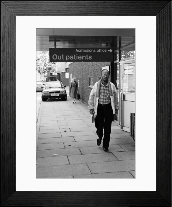 Framed Print : Actor Douglas Lambert who has been diagnosed with AIDS leaving St Stephens Hospital