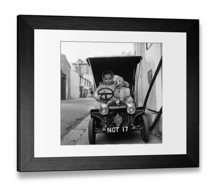 Framed Print : Judy Oliver in her vintage baby car. 1st March 1964