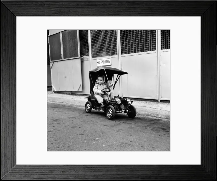 Framed Print : Judy Oliver in her vintage baby car. 1st March 1964 Framed Print : Judy Oliver in her vintage baby car. 1st March 1964