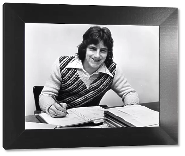 Tranmere Rovers footballer Steve Coppell sitting at his desk as he studies for his degree