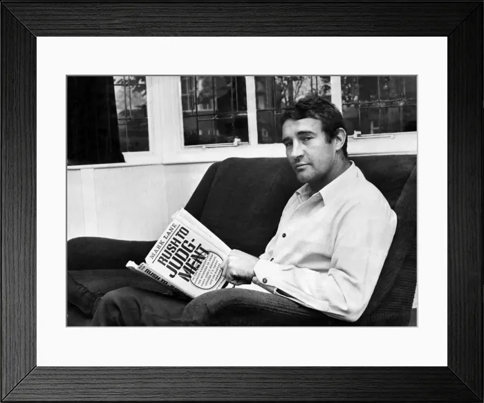 Framed Print : Manchester City assistant manager Malcolm Allison pictured at home reading his book
