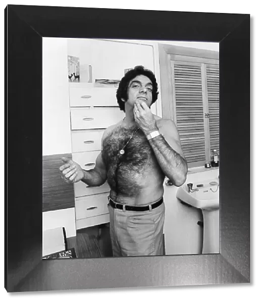 Singer Frankie Vaughan poses in his bathroom at home. December 1970