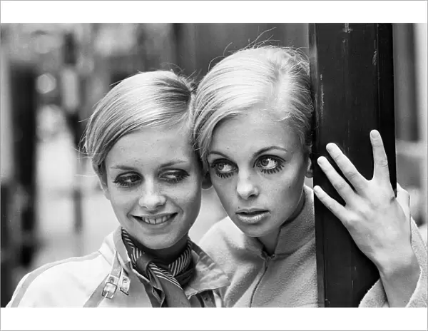 Model Twiggy seen here modelling a mini dress with her Swedish 'double'